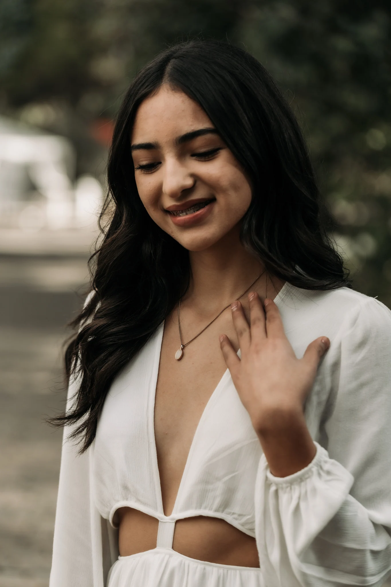 A woman's portrait in soft natural light, wearing an ivory blazer
